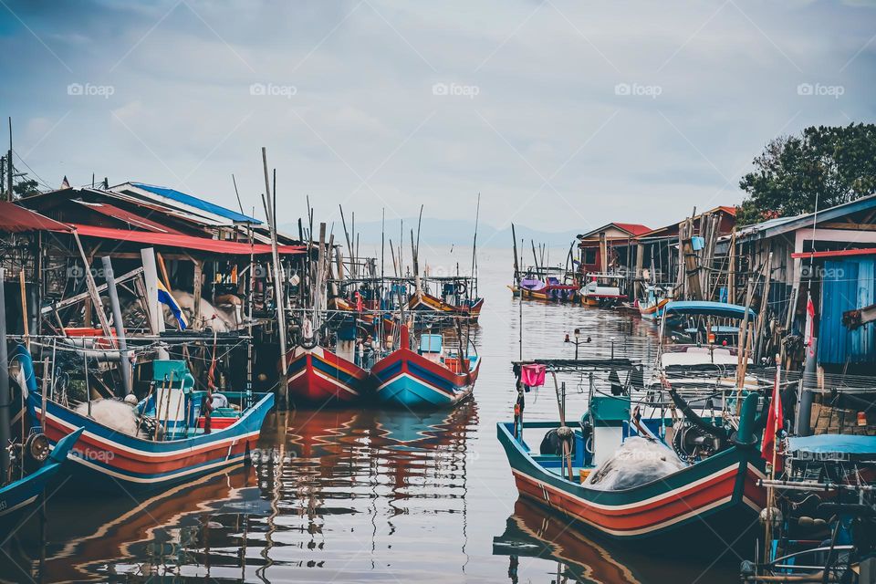 Fisherman village view with fishermen boats in the water