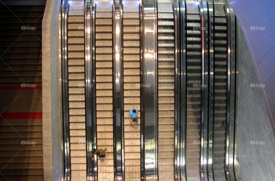 above People on escalator