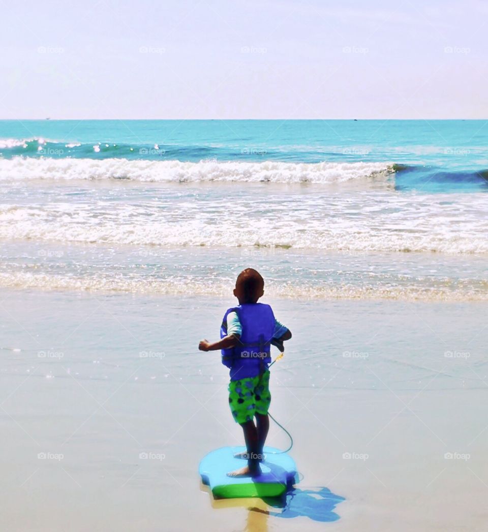 Little boy on a boogie board 