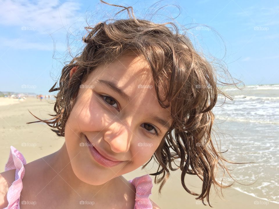 Cute seven year girl at the beach