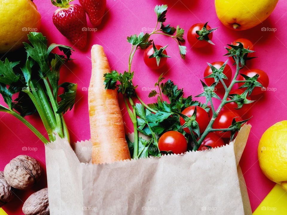 paper bag with fruits, vegetables and healthy food
