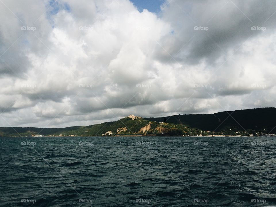 Cloudy sky over mountains and sea