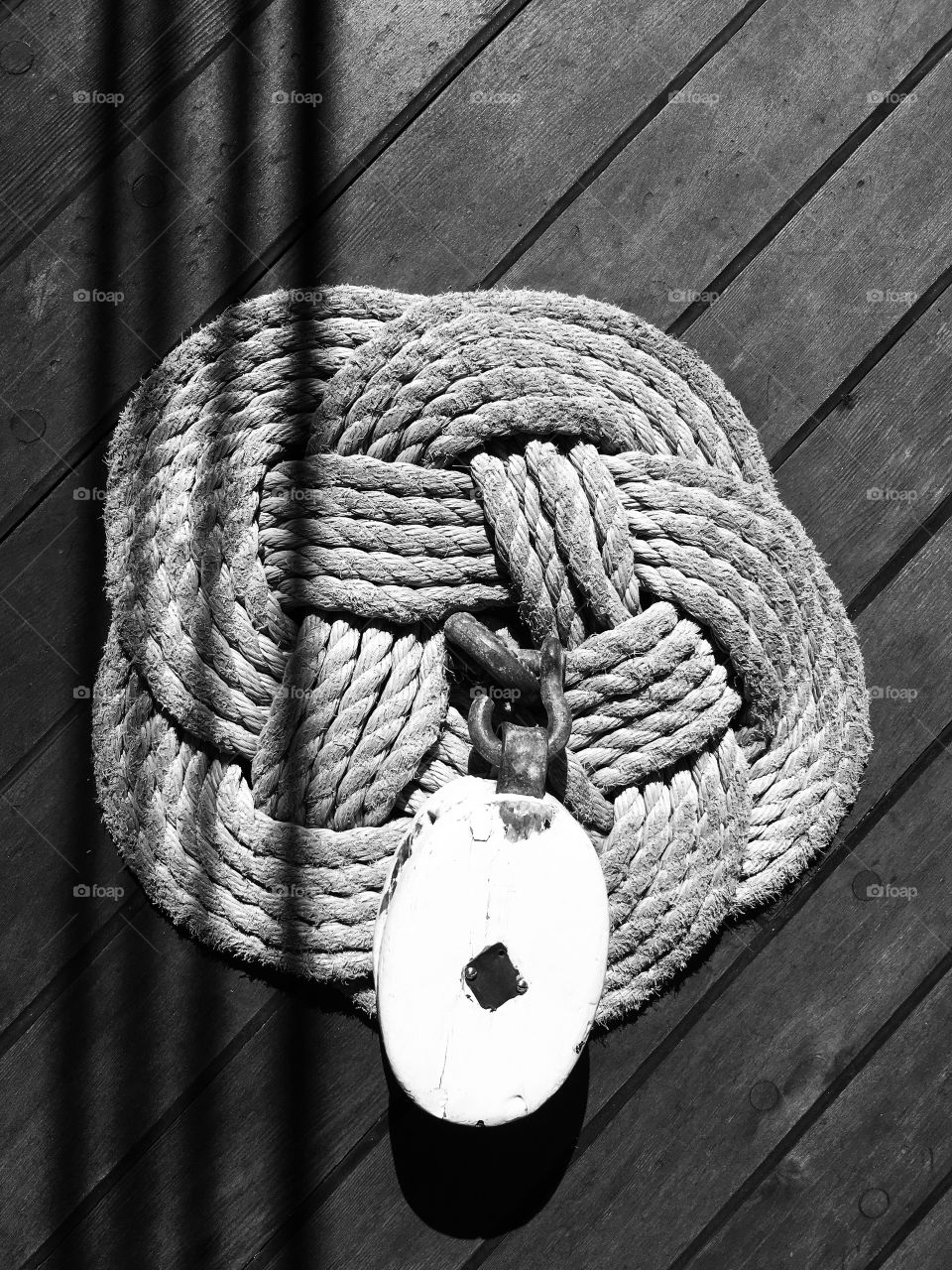 A grey rug on the floor of an adventure yacht. 