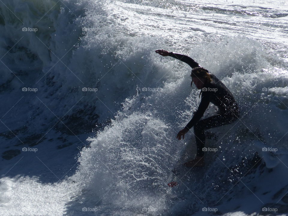 Surfer balancing on a ride