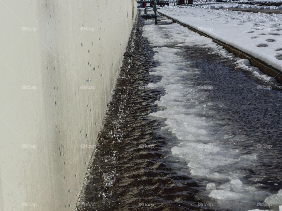 Snow melting falling off the roof