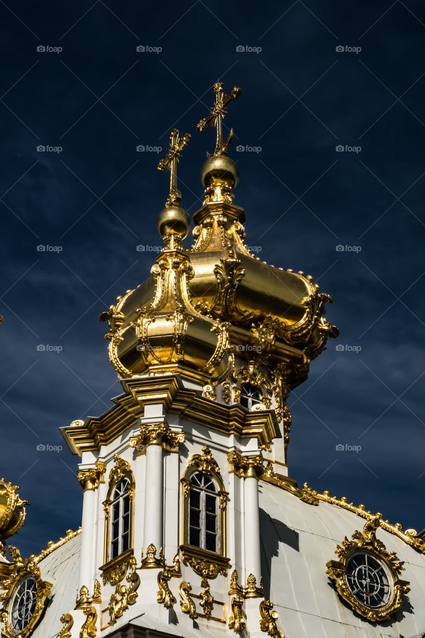 The cathedral with golden domes is located in St. Petersburg Peterhof Fountains