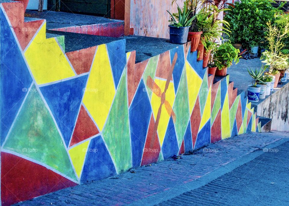 Colourful painted triangular shapes.