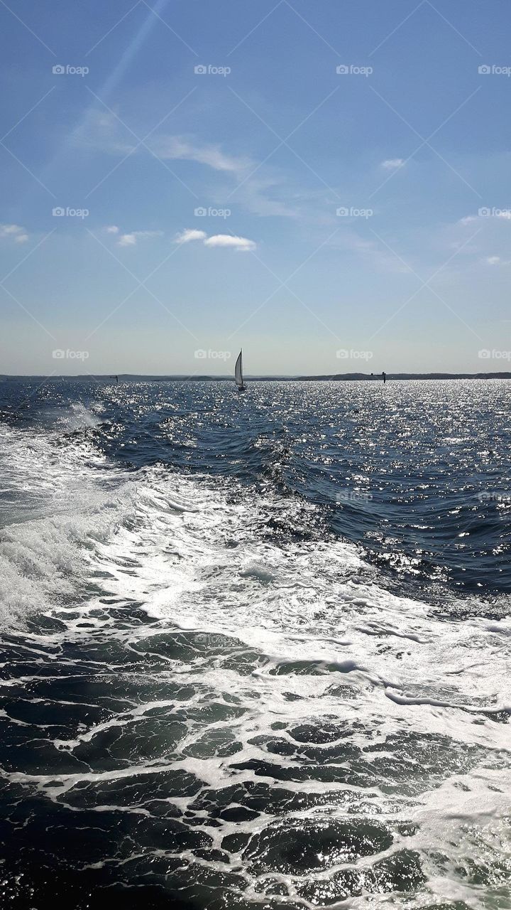 Sailboat on the blue sea