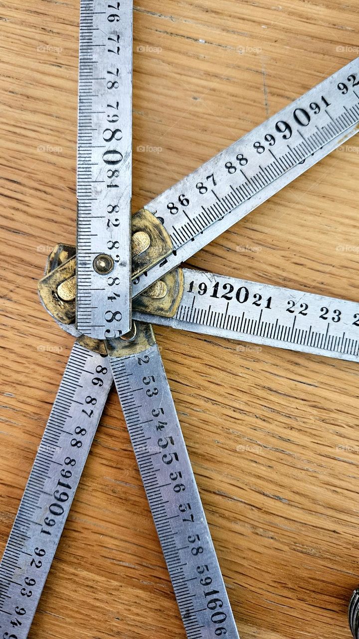 Metal vintage folding measure with a lot of patina