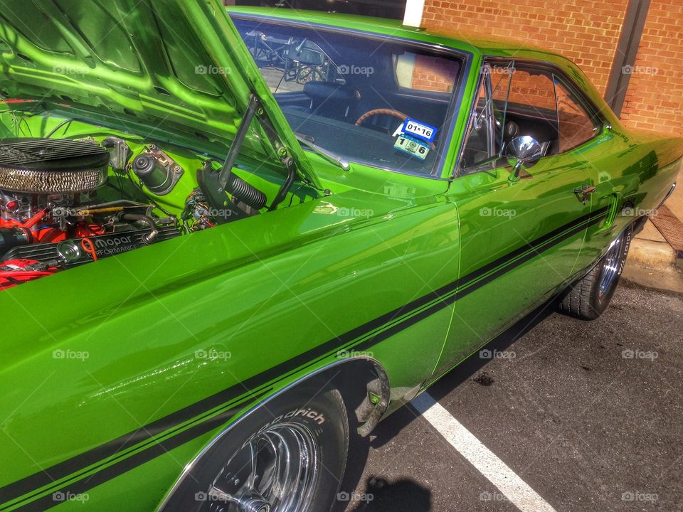 Mean green vintage machine. Classic car at a car show