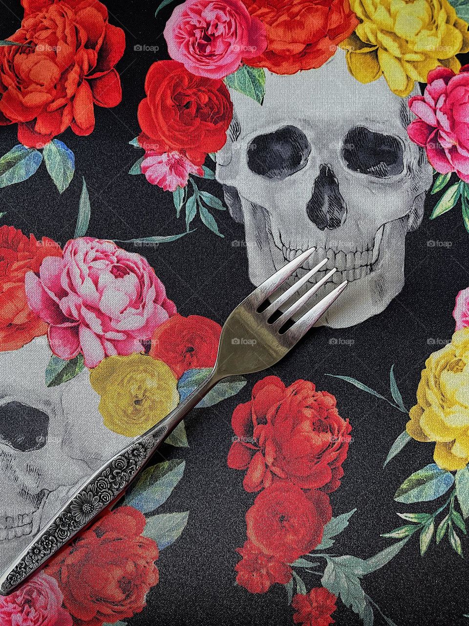 Fork feeds a skull, fork with skull and flowers, forks and skulls, making skulls eat, flowers and forks, seeing forks differently 