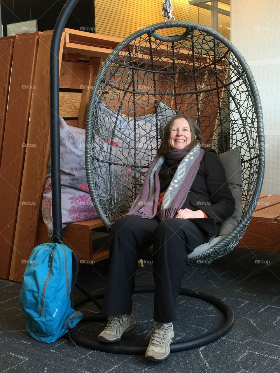 Woman sitting on bamboo swing