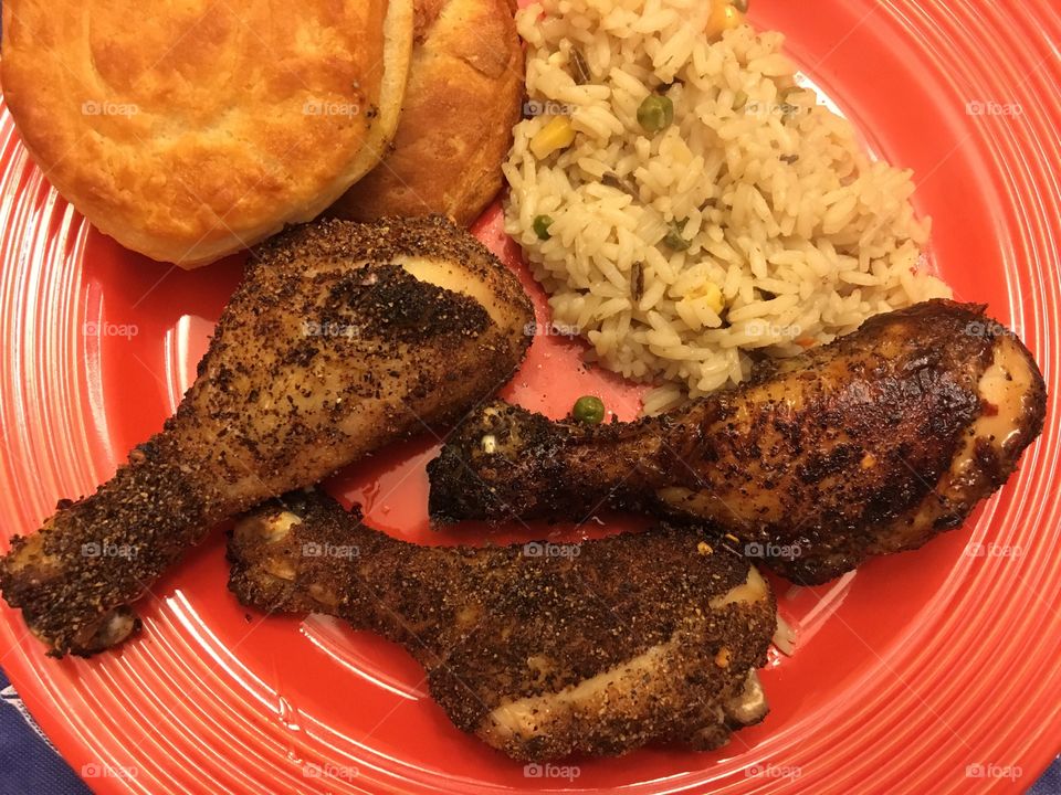 Drumsticks, rice, and biscuits