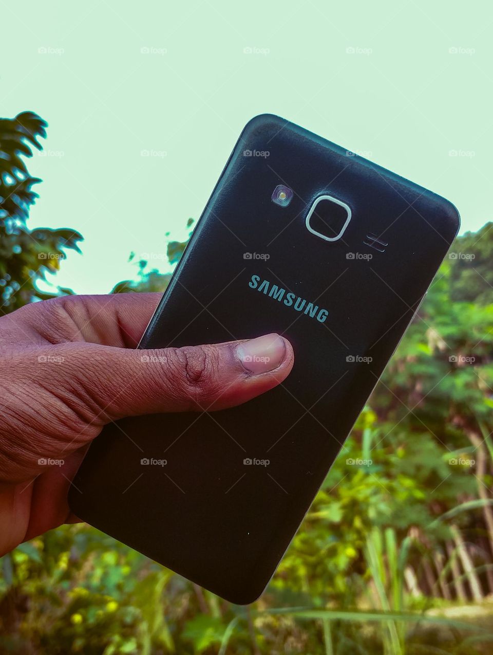 Samsung mobile phone holding on hand