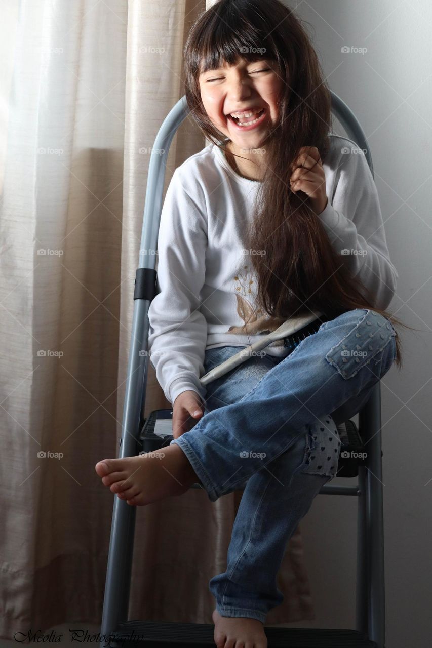 Laughing girl with a gorgeous long hair