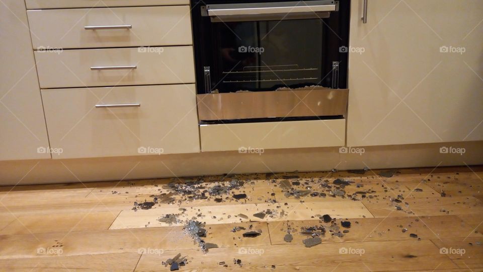 Oven front door explosion. Shattered glass on kitchen floor.