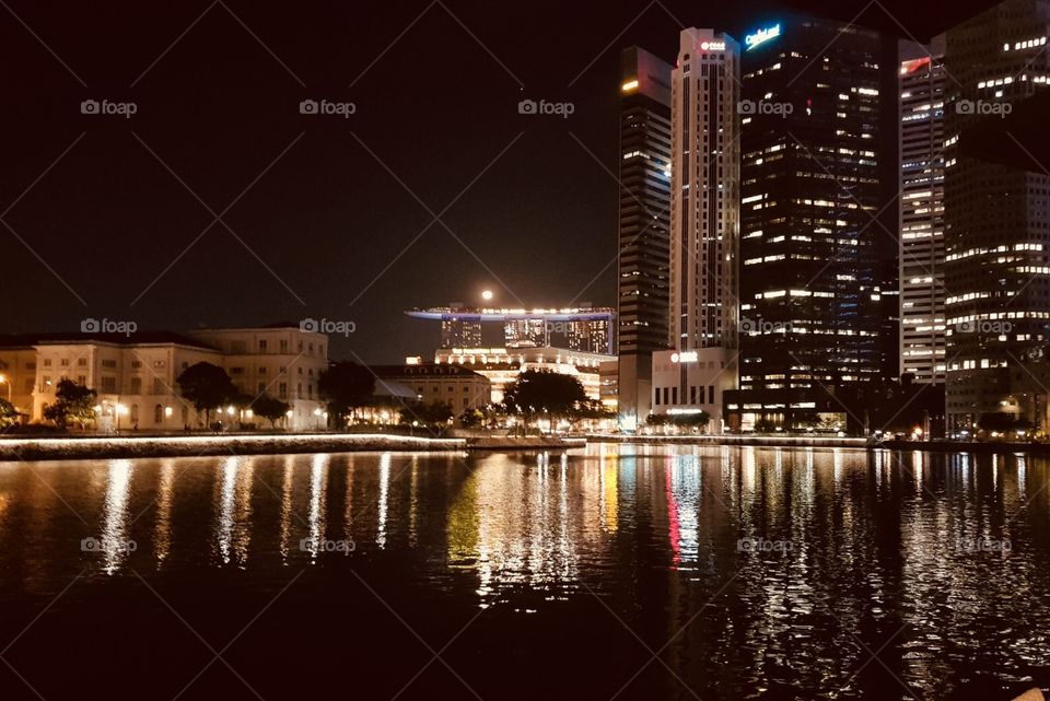 A beautiful night with moon on Marina Bay Sands , Singapore 