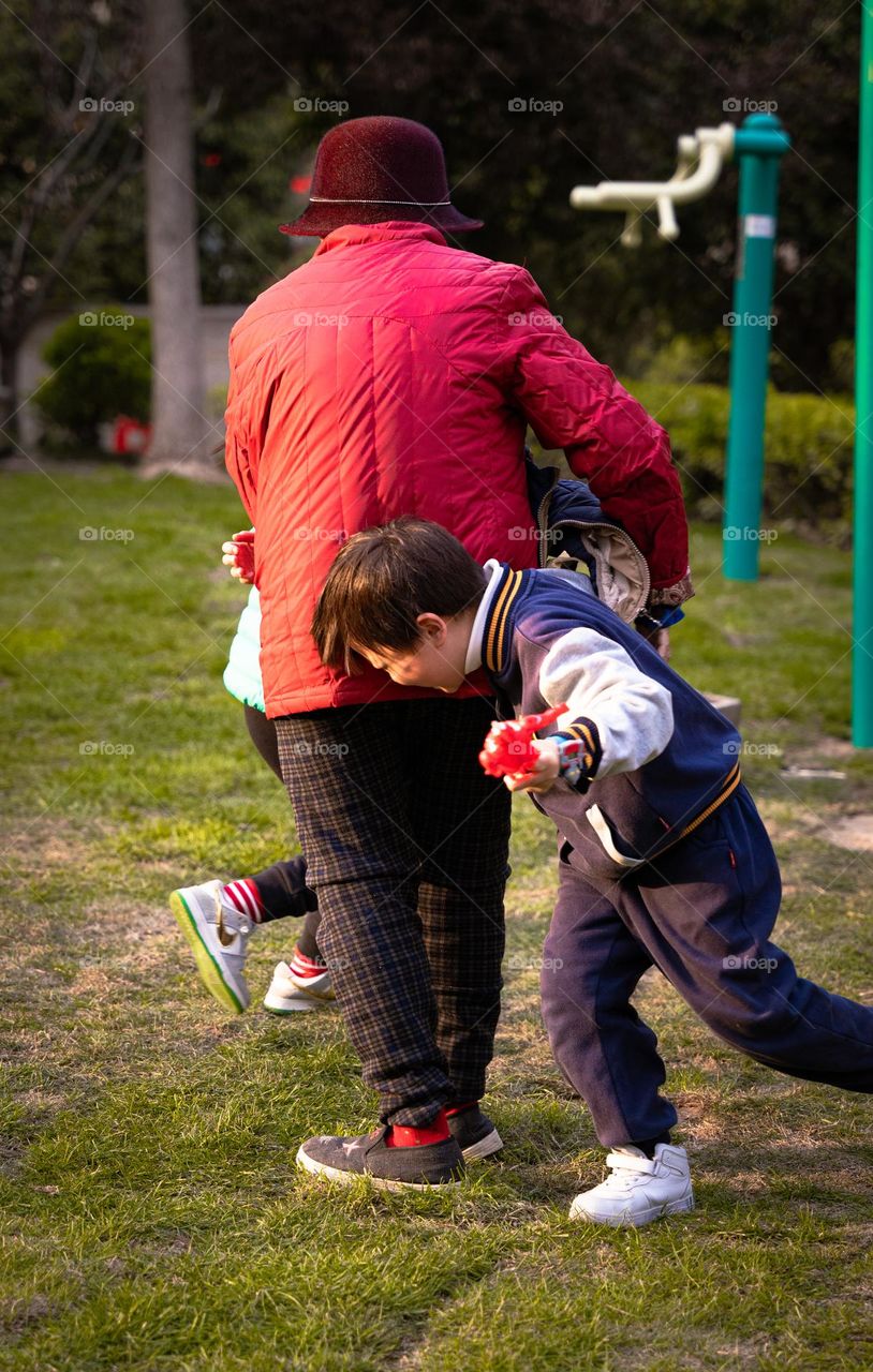 Kids playing with their grandma