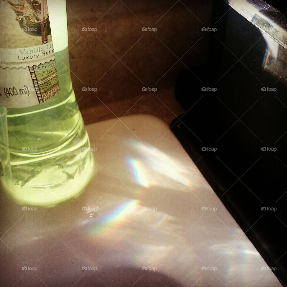 Sunlight through a soap dispenser