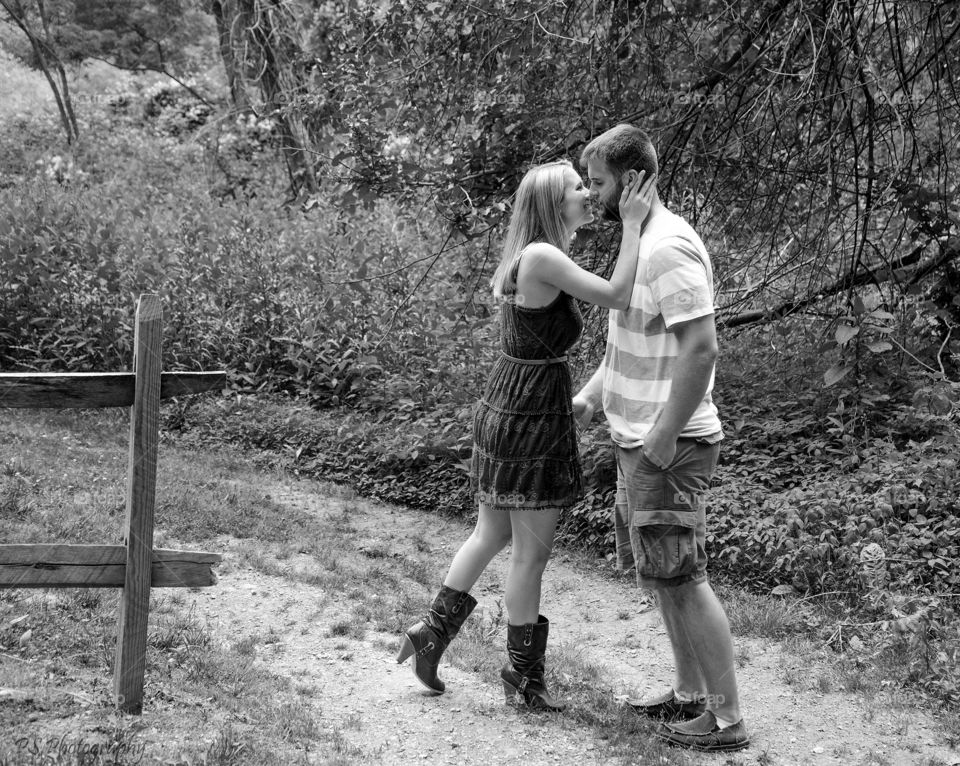 Couple kissing in forest