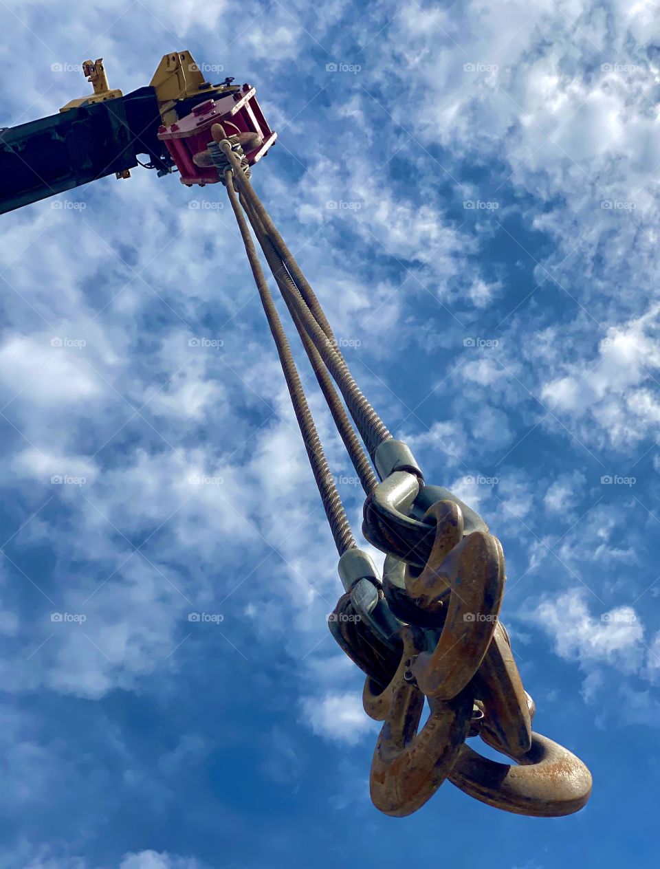 A construction machine surrounded by a cloudy sky 