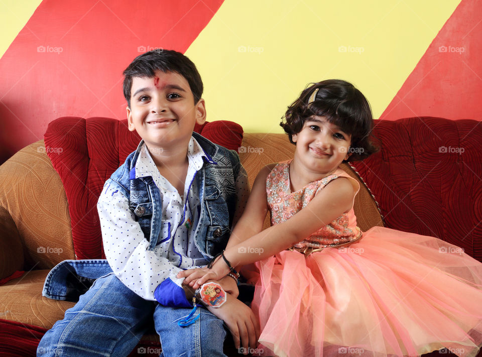 Brother and sister during Indian festival Raksha Bandhan