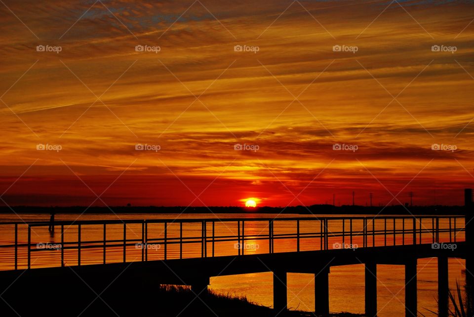 Silhouette of bridge at sunset