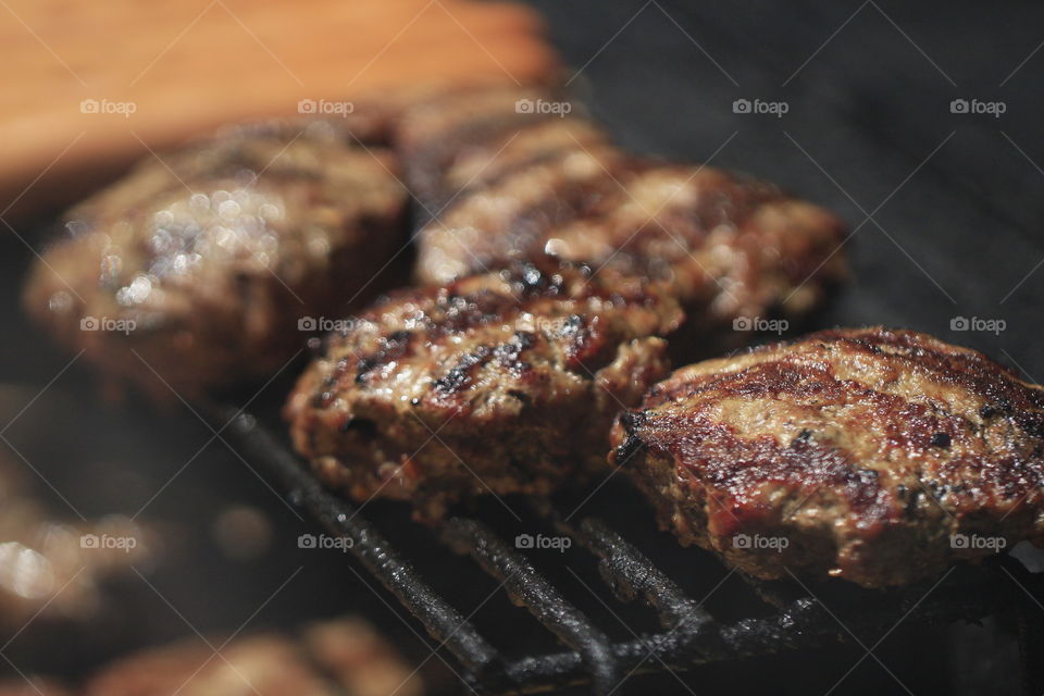 Delicious hot grilled burgers on a refreshing summer day, with family and friends.