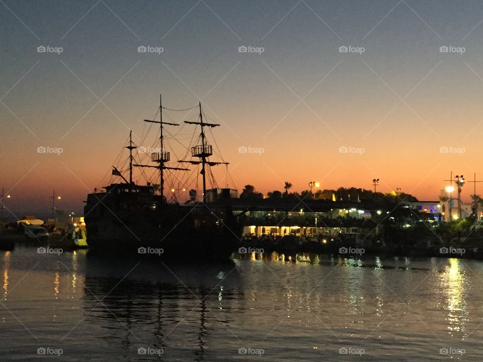 Ship docked at sunset