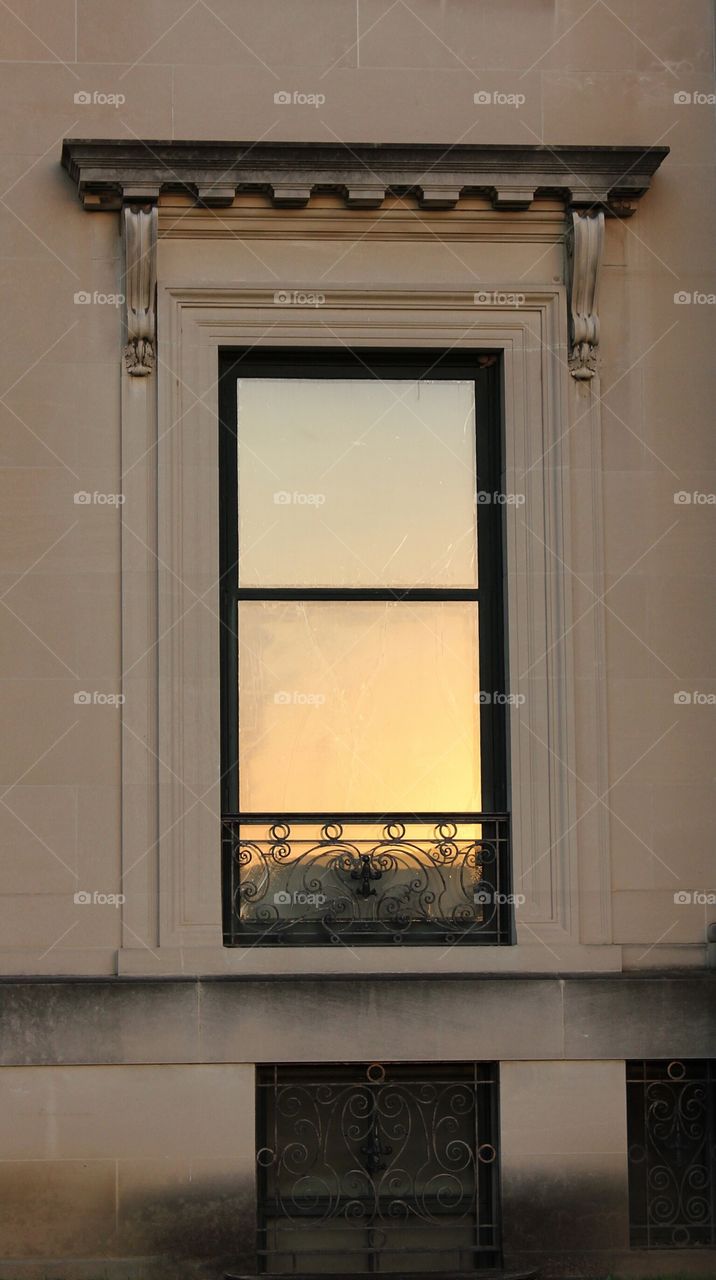 Sunset  reflection in a window on a mansion on the Hudson River, NY  - windows around the world mission 