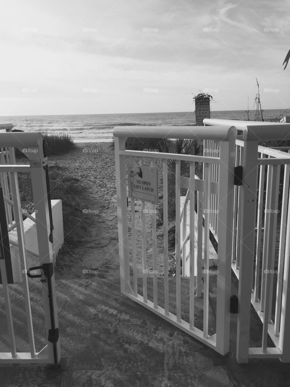 Beach thru the gate . A gate opening up to the beach