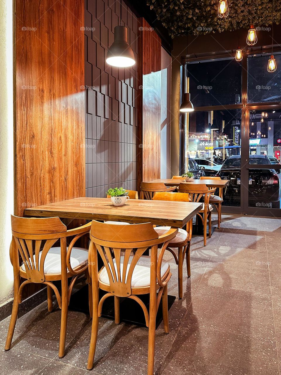 A simple café interior setting, with warm colours and lighting.