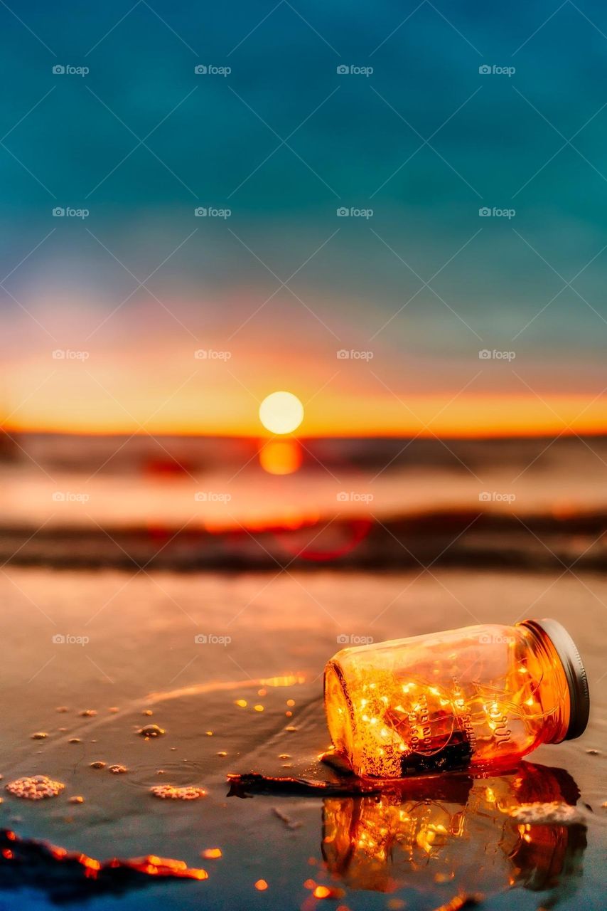 Orange Mason Jar in Body of Water