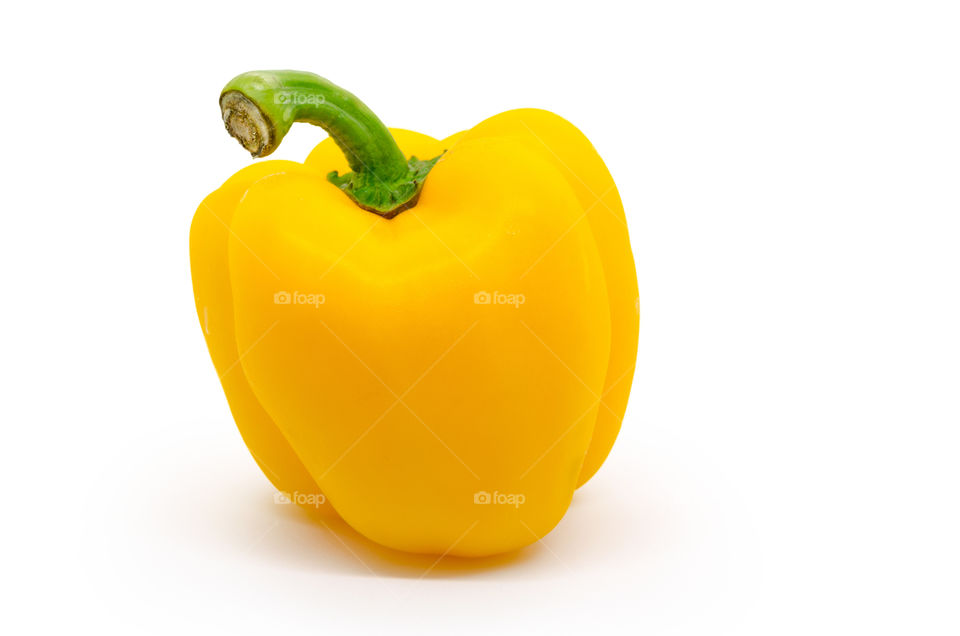 Sweet yellow bell pepper isolated on white background.