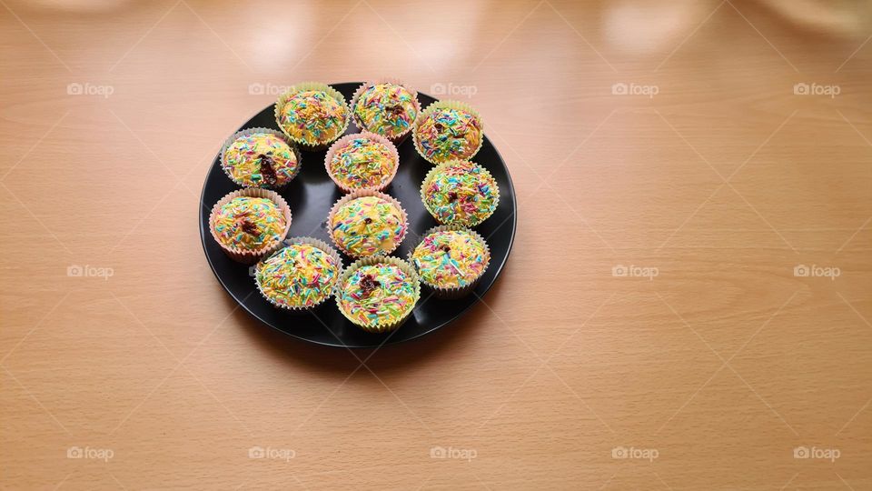 Plate with muffins on the table