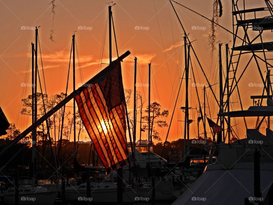 American Flag at the marina during sunset - Sunset vs Sunrise - The Golden Hour offers plenty of opportunities for great photos, and the really beautiful thing is that it happens twice a day