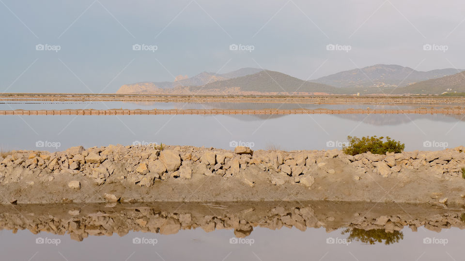 Reflection of rocks and mountain