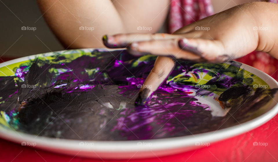 painting with hands and tempera