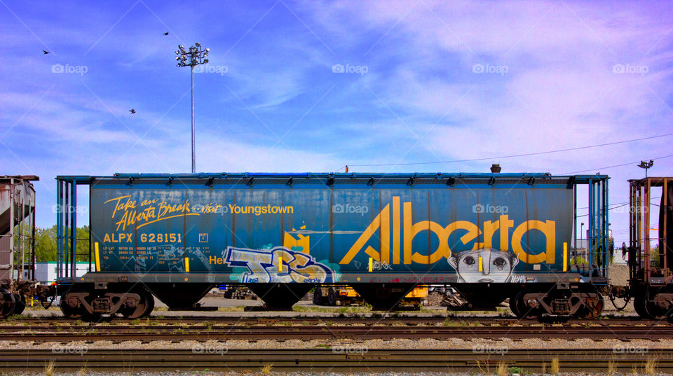 sky graffiti blue train by argyllsbeard