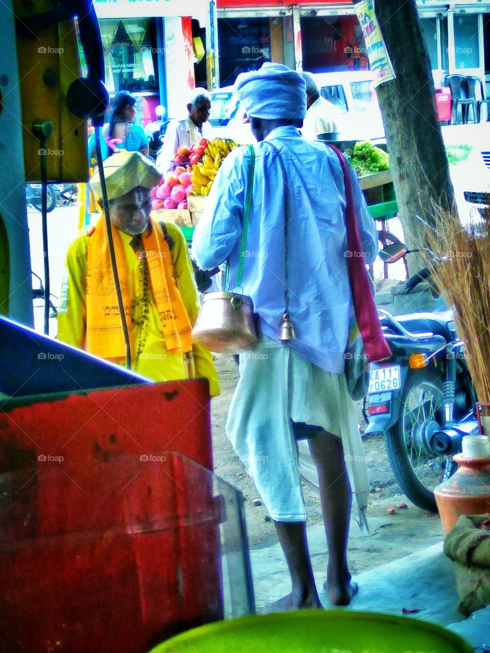 Asian sadhu standing on street