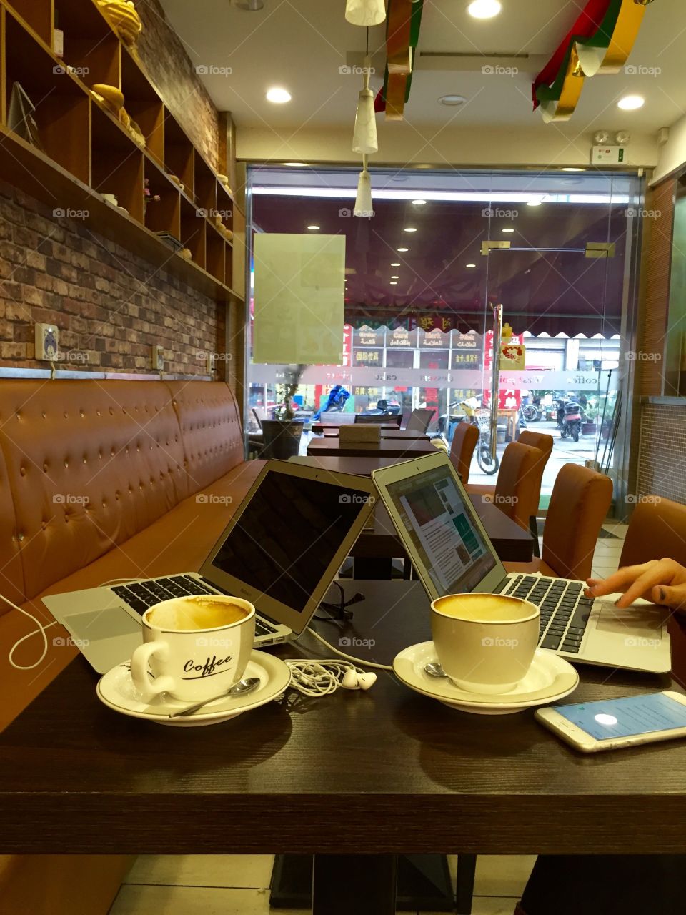 Two laptops and coffees in the coffeeshop