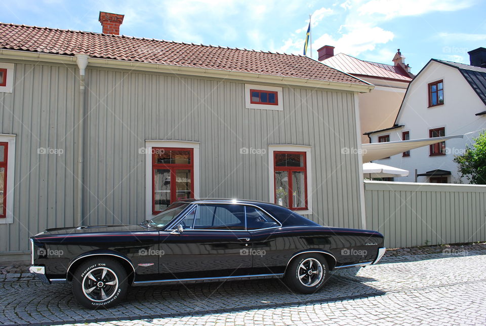 Vintage Car parked in small European town 