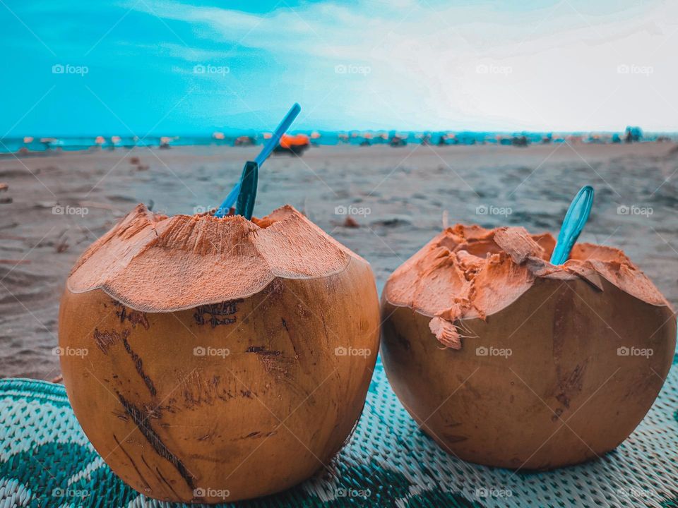 Summer vibes. Drinking coconut on the beach🥥🌺🏞🍃