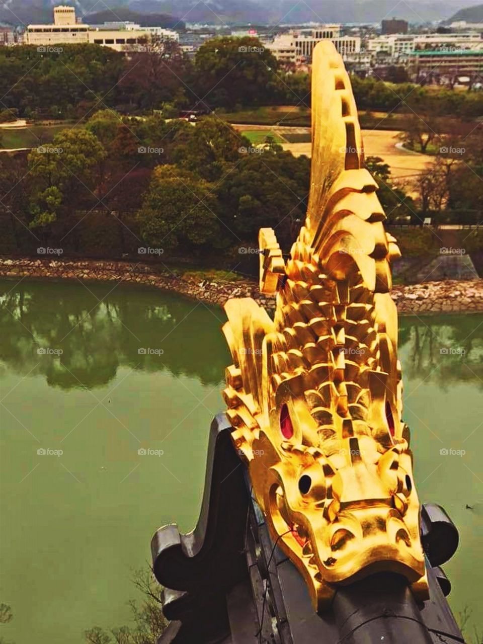 Golden Decor on Tiled Roof of a Castle