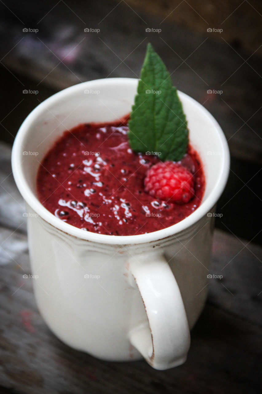 Raspberry smoothies in mug