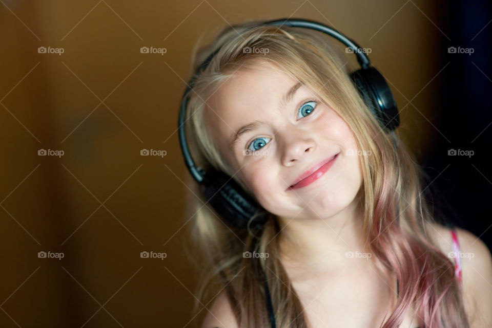 Smiling girl with headphones