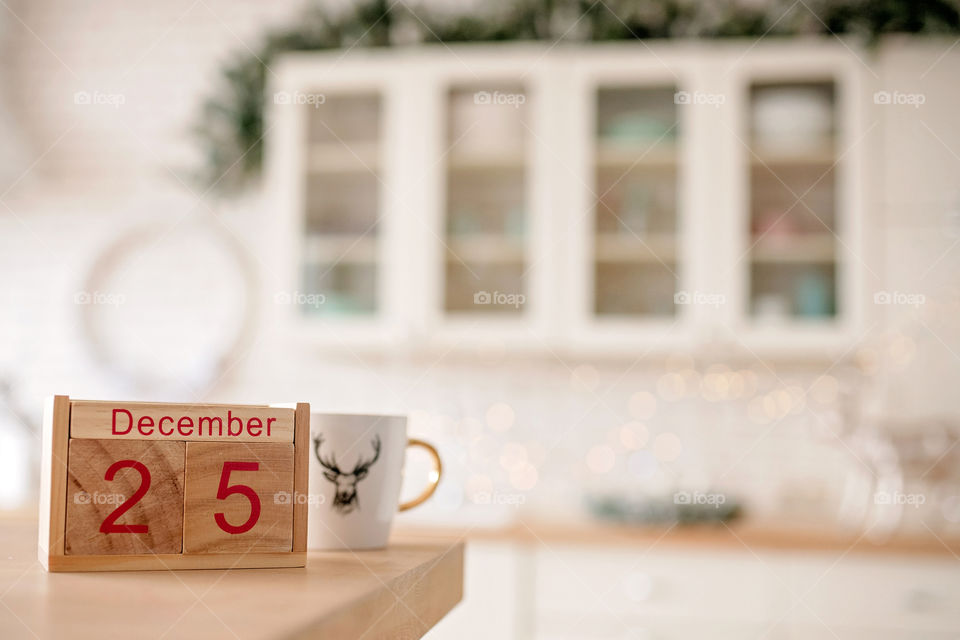 Christmas background with wooden block calendar with the date of December 25