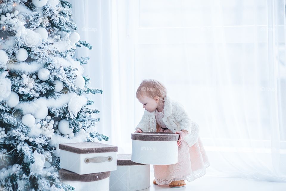 Girl and Christmas tree 