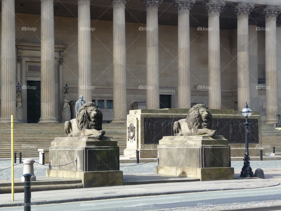 Liverpool Lion Statues At St. George's Hall... A Neoclassical Stone Building With Pillars