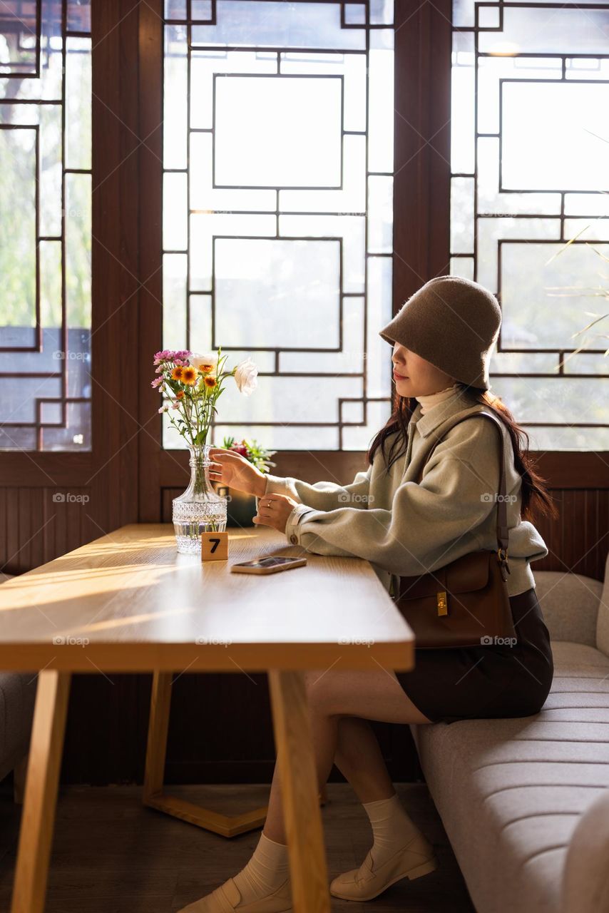 Stylish woman in cafe